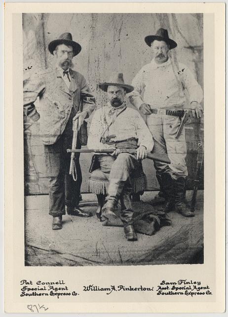 William A. Pinkerton with railroad special agents Pat Connell (left) and Sam Finley (right), full-length portrait]